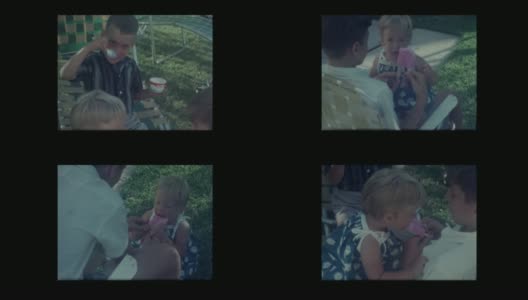 1964年男孩给小女孩吃冰淇淋冰棒高清在线视频素材下载
