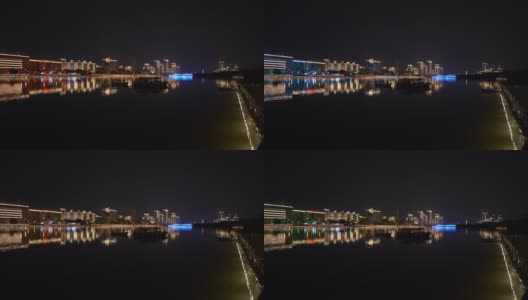 三亚市夜景时间，灯火通明的滨江公寓楼全景4k中国海南高清在线视频素材下载