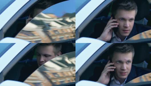 监视坐在车里接电话的商人，机密信息高清在线视频素材下载