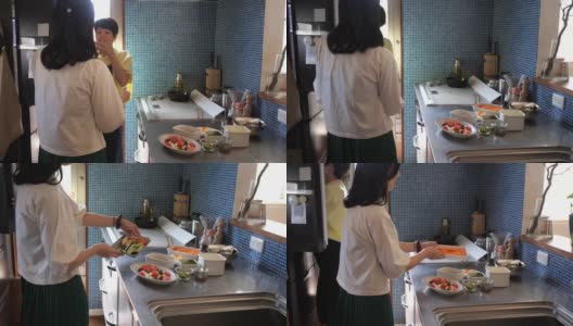 从冰箱里拿食物参加午餐聚会的女人高清在线视频素材下载
