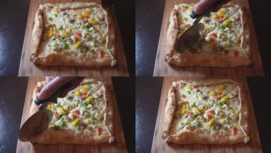 在木托盘上切一个长方形的披萨高清在线视频素材下载