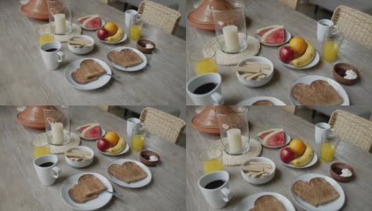 美味的早餐摆在家里的餐桌上高清在线视频素材下载