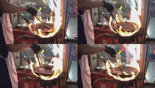 男子炒米粉。泰国街头快餐热锅在中国镇，泰国。高清在线视频素材下载