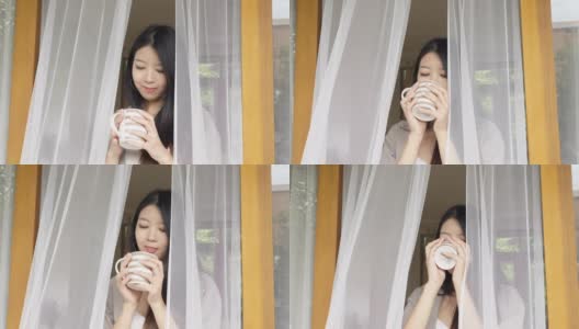 可爱的亚洲女人打开门在早上和放松高清在线视频素材下载