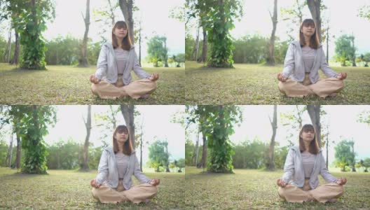 亚洲女人在公园冥想高清在线视频素材下载