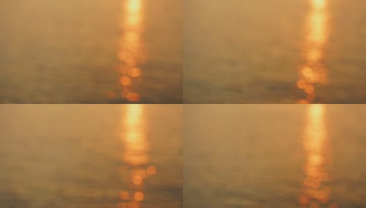 美丽的暗金色海水背景与太阳路径日落或早晨的太阳在平静的水面高清在线视频素材下载
