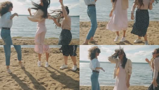 女性朋友们穿着时髦的夏装在海滩上跳舞，一起享受周末高清在线视频素材下载