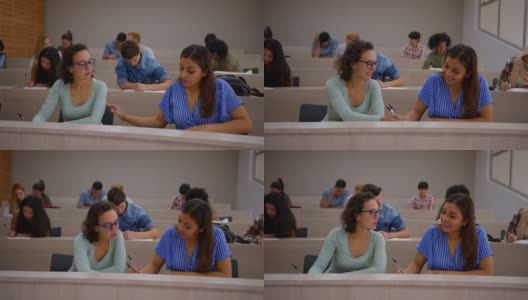 一名女大学生在全班同学都在写笔记本的时候向她的朋友提问高清在线视频素材下载