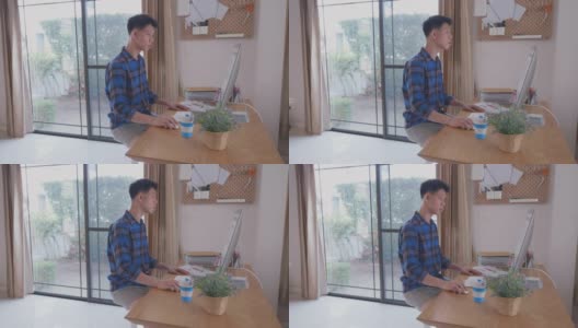 东南亚男人在家工作高清在线视频素材下载