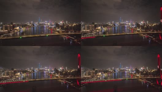 无人机航拍的标志性桥梁城市和城市天际线在夜间高清在线视频素材下载