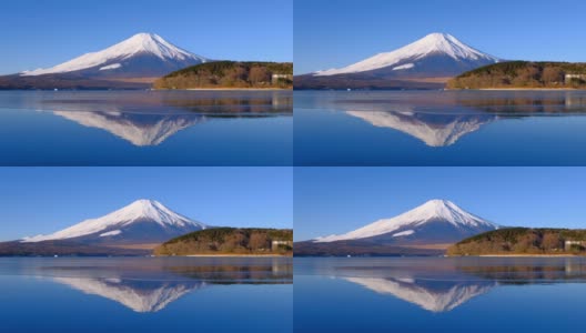 从冰冻的山中湖上倒立的富士山和蓝天高清在线视频素材下载