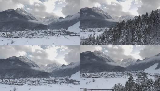 空中拍摄的雪山峡谷下面的山顶高清在线视频素材下载