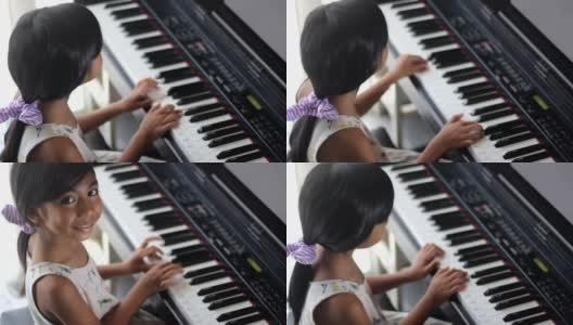 学弹钢琴的亚洲女孩高清在线视频素材下载