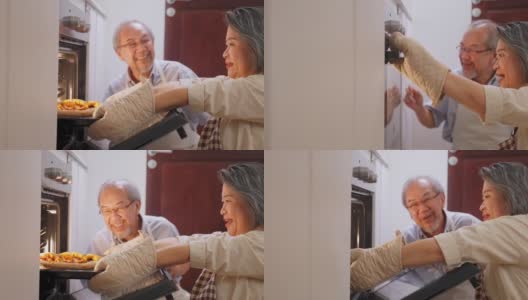 亚洲的老祖父母在家做披萨。一位老妇人打开烤箱，把食物从机器里拿出来。老人面带微笑看着饭菜，闻一闻，一起享受家庭活动。高清在线视频素材下载