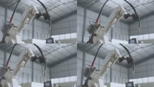 工业4.0概念现代自动化机器人焊接臂机床焊接金属管道和钢板与明亮的火花和烟雾在生产工厂车间的事实背景高清在线视频素材下载