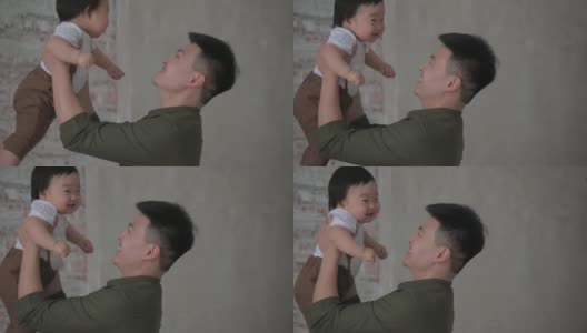 快乐年轻的亚洲爸爸和可爱的小可爱的婴儿儿子玩高清在线视频素材下载