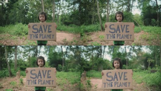 孩子举着“拯救地球”的标语高清在线视频素材下载