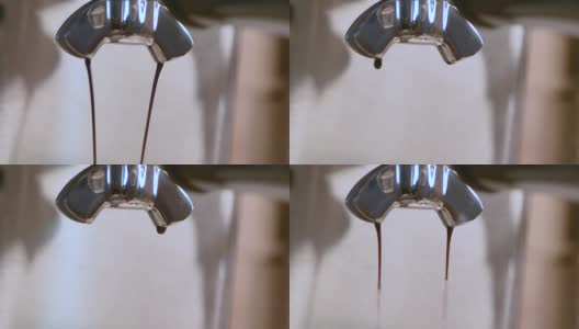 特写镜头从浓缩咖啡机壶嘴的两边倒浓缩咖啡高清在线视频素材下载