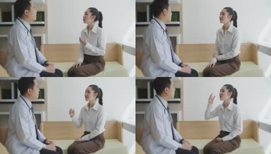 一个亚洲男性整形外科医生的肖像与一个女性病人在诊所咨询医学检查医学和保健的概念。高清在线视频素材下载