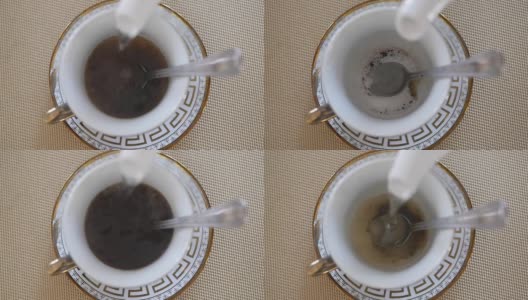 把茶倒进杯子里。从茶壶中倒出开水。慢镜头高清在线视频素材下载