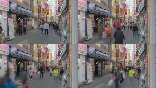 延时拍摄:韩国首尔明洞市中心购物街的行人高清在线视频素材下载