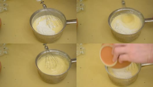 将面粉与搅打好的鸡蛋和糖混合，制作蛋海绵高清在线视频素材下载