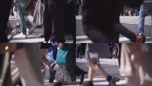 慢镜头人群在人行横道上行走。高清在线视频素材下载