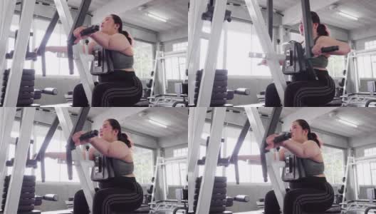 年轻女子在健身房锻炼高清在线视频素材下载