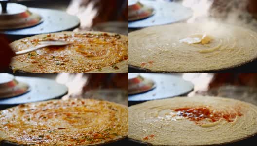 印度孟买，街头小吃摊贩用必备食材煎炸印度薄饼高清在线视频素材下载