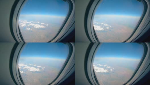 从飞机上可以看到云层和陆地高清在线视频素材下载