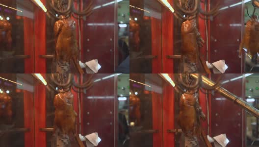 慢动作拍摄的一个咖啡馆的窗口和著名的传统中国烤鸭高清在线视频素材下载