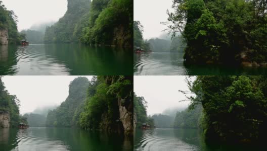 沿江航行，欣赏张家界山脉覆盖的热带雨林高清在线视频素材下载