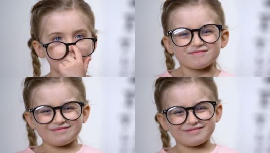 可爱的微笑的女孩调整眼镜，聪明的孩子，女学生，教育高清在线视频素材下载