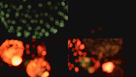 黄色、红色和绿色的圆形烟花在美丽的假日夜景中绽放高清在线视频素材下载