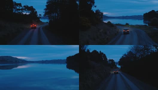 鸟瞰图汽车行驶在乡村道路上，SUV驾驶在黄昏与前灯穿过松树高清在线视频素材下载