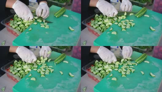 男人正在切新鲜的黄瓜蔬菜高清在线视频素材下载
