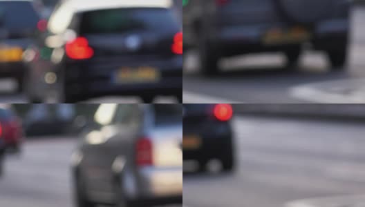 街道上的汽车失去焦点:街道上汽车的背景镜头高清在线视频素材下载