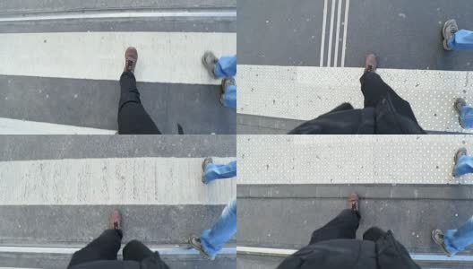 在人行横道上的人的观点。男人的靴子一步一步的慢动作高清在线视频素材下载