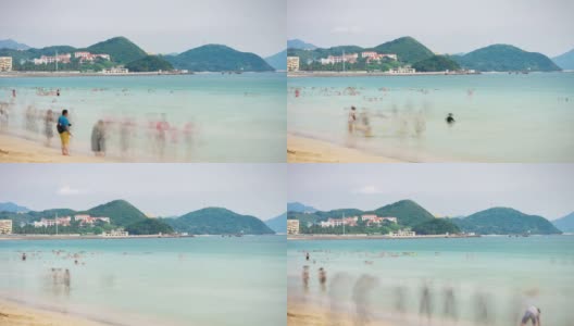 日落三亚著名的大东海拥挤的海滩全景4k时间推移海南岛中国高清在线视频素材下载