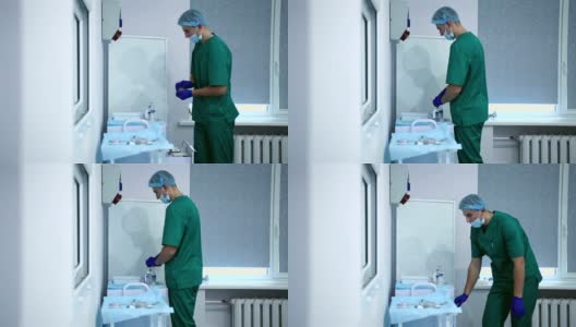 一位年轻的麻醉师正在为手术做准备。高清在线视频素材下载
