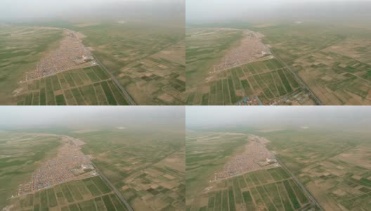 村庄和道路鸟瞰图，新疆，中国。高清在线视频素材下载