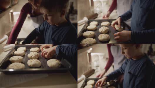 母亲和儿子在烤小面包高清在线视频素材下载