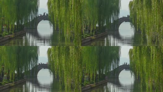 杭州城市阳光明媚的夏日著名的湖拥挤的桥全景，时光流逝4k中国高清在线视频素材下载