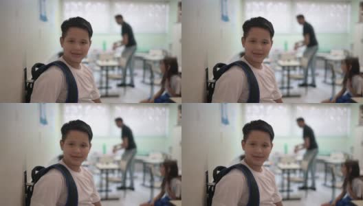 一个小学生站在教室门口的肖像高清在线视频素材下载