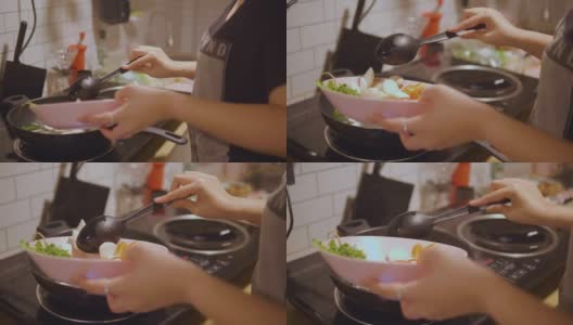 亚洲妇女在家里做东百胜开泰国菜。高清在线视频素材下载