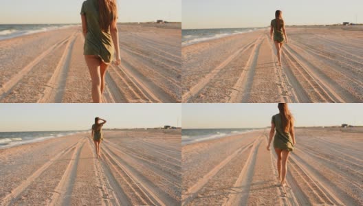 女人走在海滩沿着海滨丁字裤比基尼内裤高清在线视频素材下载