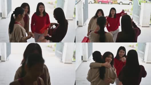 美丽的年轻亚洲妇女访问她的祖父母家给父母的礼物和食物在中国新年高清在线视频素材下载