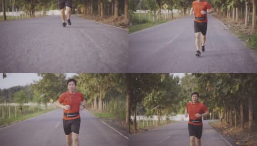 男性放松:早上在柏油路上跑步高清在线视频素材下载