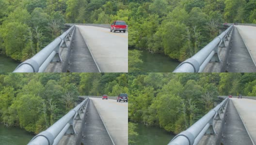 在阿什维尔的法国宽阔河上的桥上行驶的汽车高清在线视频素材下载