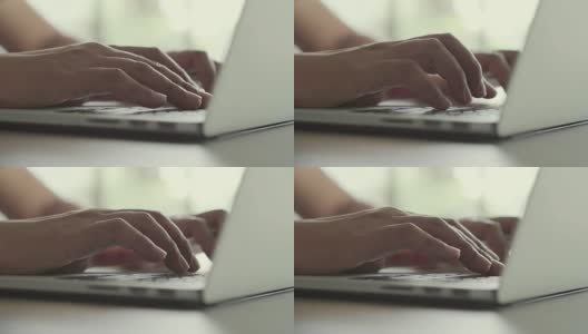 特写的手工作和打字在笔记本电脑键盘上的桌子高清在线视频素材下载